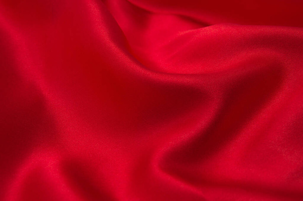 Κόκκινο σατέν ή μεταξωτό ύφασμα ως φόντο - Φωτογραφία, εικόνα