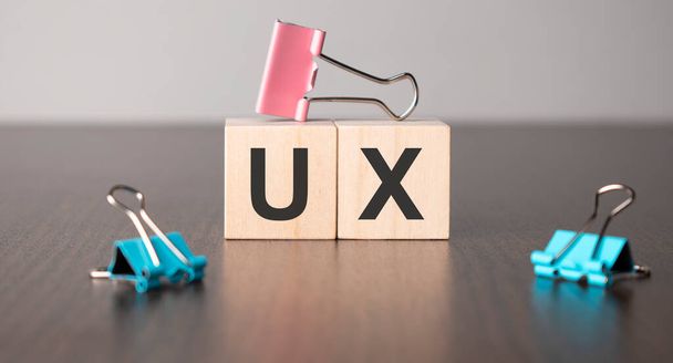 Businesswoman made word ux with wood building blocks. - Foto, afbeelding
