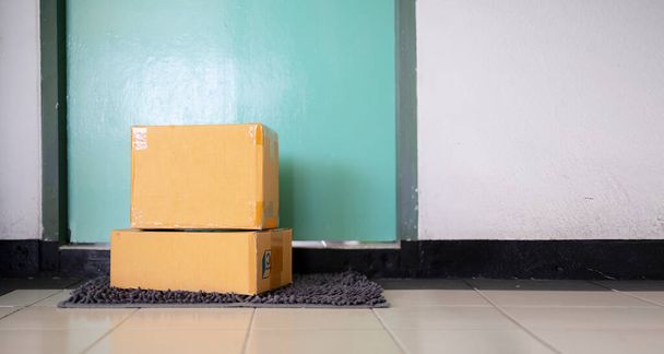 A parcel box placed at the front of the door. Quarantine, contactless delivery during a pandemic covid. Stay at home, Online shopping. - Photo, image