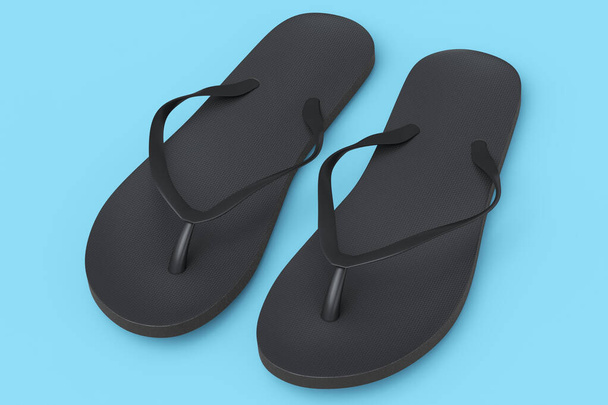 Beach black flip-flops or sandals isolated on blue background. - Foto, imagen