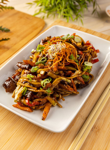 Close up of pork stir fried with noodles and vegetables - Photo, Image