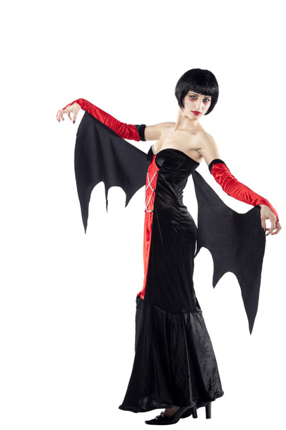 Young woman posing as vampire - 写真・画像