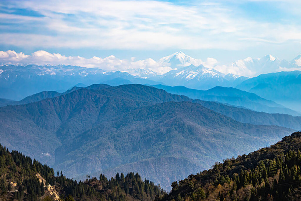 multilayer mountain range of himalaya with valley view and amazing sky at day from flat angle image is taken at bomdila arunachal pradesh india. - Foto, imagen