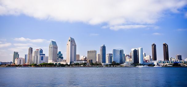 San Diego city skyline at sunset, showing the buildings of downtown rising above harbor viewed from Coronado Island. - Photo, Image