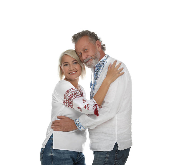 Happy mature couple in Ukrainian national clothes on white background - Foto, imagen