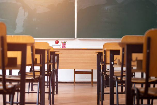 Back to School Concept. Empty classroom with chairs, desks and chalkboard. - Photo, Image