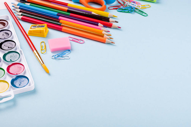 School supplies on a color background. - Фото, изображение