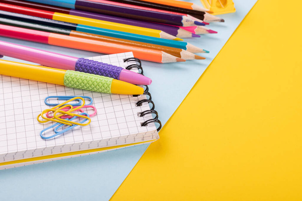 School supplies on a color background. - Фото, изображение