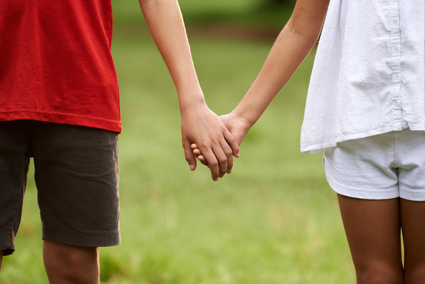 Children in love, boy and girl holding hands - Zdjęcie, obraz