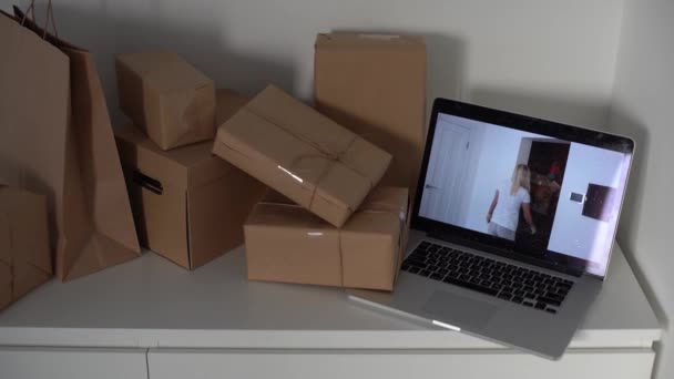 Craft paper bags and cardboards blank box presented on table, laptop - Filmagem, Vídeo