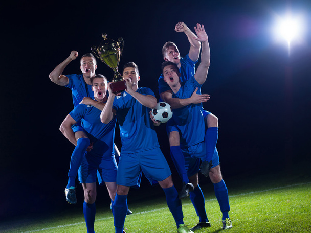 Soccer players celebrating victory - Foto, afbeelding
