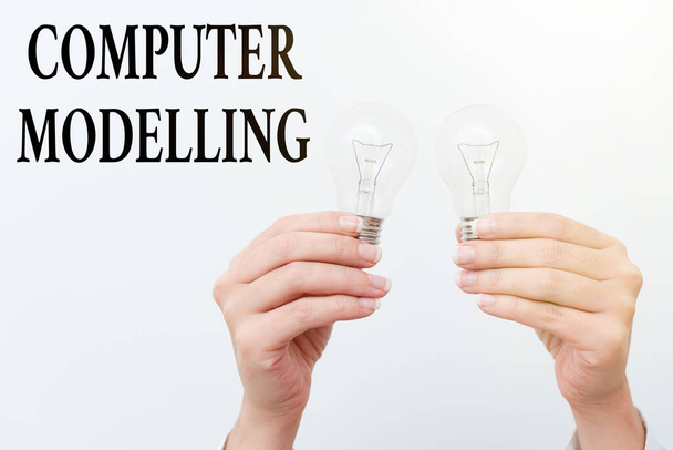 Inspiration showing sign Computer Modelling. Conceptual photo using a computer to make a model of a plan or design two Hands holding lamp showing or presenting new technology ideas - Photo, image