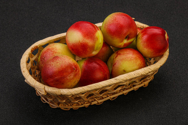 Sweet small green nectarines in the basket - Photo, Image