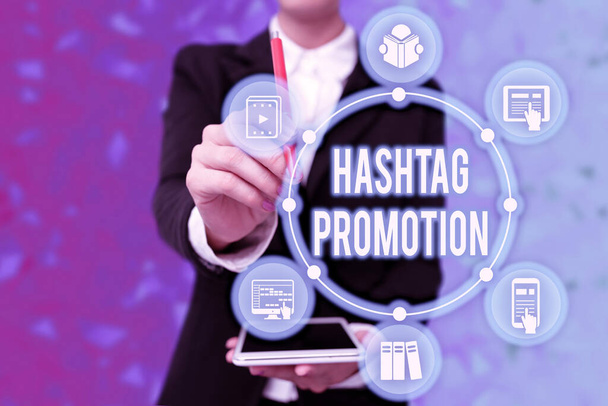 Handwriting text Hashtag Promotion. Business approach more showing can discover and engage with your content Lady In Uniform Holding Tablet In Hand Virtually Typing Futuristic Tech. - Foto, immagini
