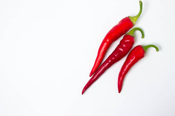Red hot chili peppers on a white background. Chili pepper isolated - 写真・画像