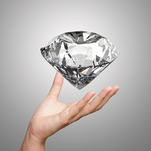 mão segurando diamante 3d sobre fundo branco
  - Foto, Imagem