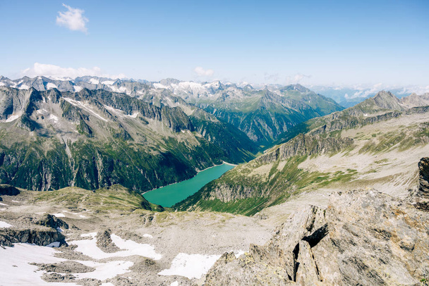 Summer alpine scenery with turquoise blue water reservoir - Fotó, kép