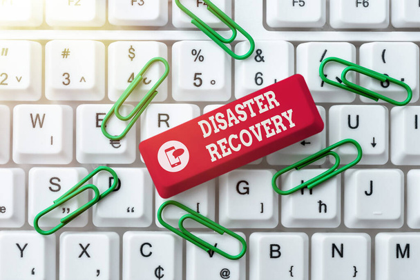 Sign displaying Disaster Recovery. Word Written on helping showing affected by a serious damaging event Abstract Typing New Spreadsheets, Organizing Filing Systems Concept - 写真・画像