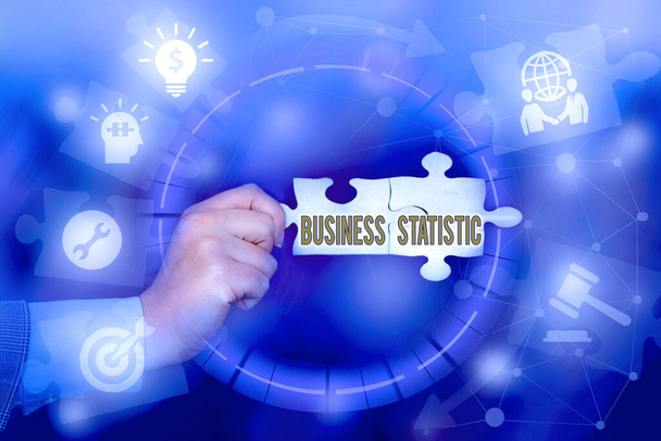 Writing displaying text Business Statistic. Business overview science of accurate and very quick decision makings Hand Holding Jigsaw Puzzle Piece Unlocking New Futuristic Technologies. - Photo, Image