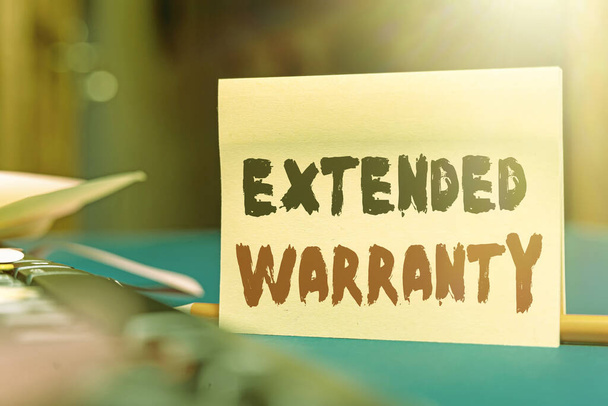 Text sign showing Extended Warranty. Business overview contract which gives a prolonged warranty to consumers Multiple Assorted Collection Office Stationery Photo Placed Over Table - Φωτογραφία, εικόνα