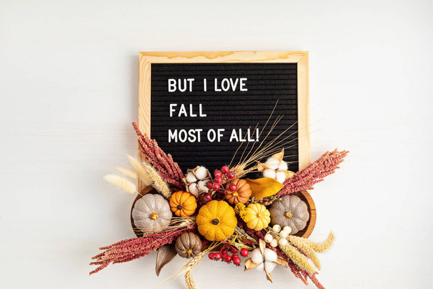 Flat lay with felt letter board and text But i love fall most of all. Autumn table decoration - Фото, зображення