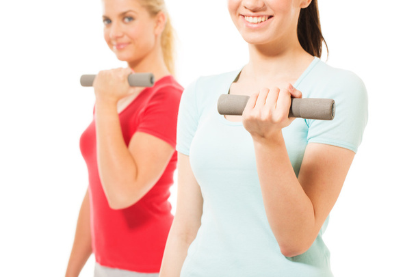 Fitness women working out with dumbbells - Fotó, kép