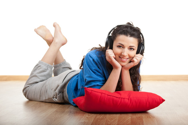Portrait of a beautiful young woman listening music - Zdjęcie, obraz