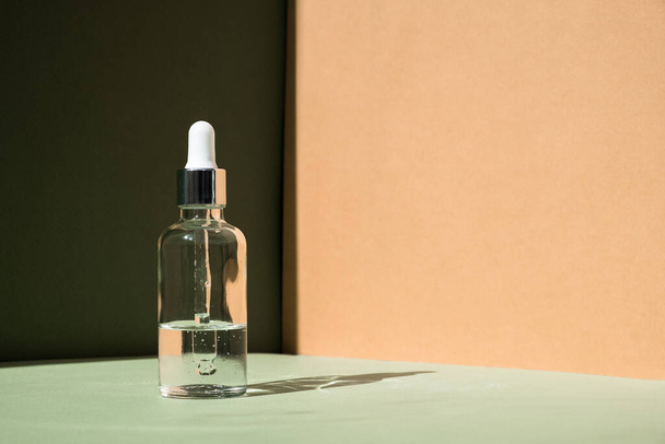 Dropper glass Bottle Mock-Up. Body treatment and spa. Natural beauty products. Eco cream, serum, skin care blank bottle. Anti-cellulite massage oil. Oily cosmetic pipette - 写真・画像