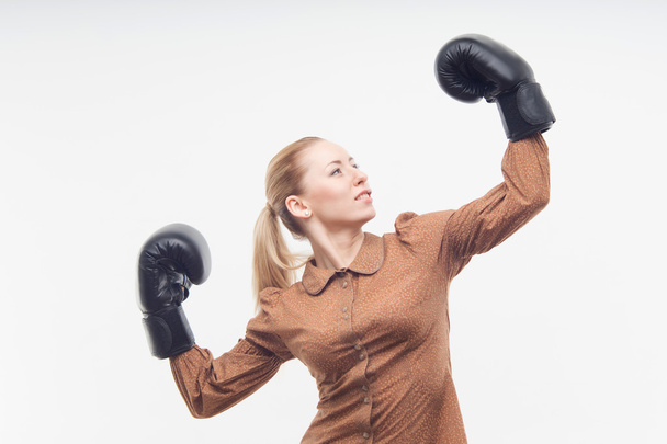 Young attractive business woman with boxing gloves - Fotó, kép