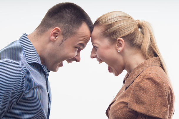 Colleagues fighting each other with foreheads together - 写真・画像