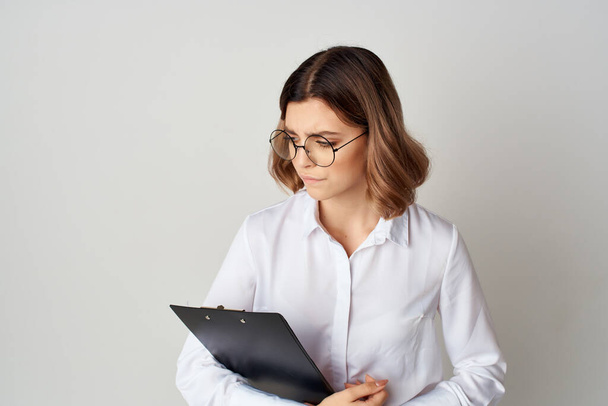Business woman in white shirt  at work with documents. High quality photo - Photo, Image