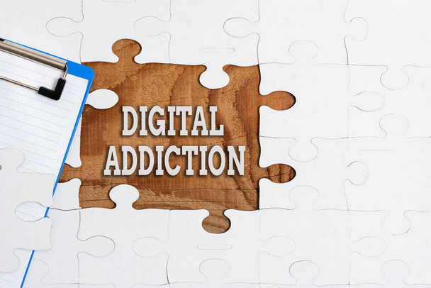 Text showing inspiration Digital Addiction. Business overview disorder that involves the obsessive use of mobile devices Building An Unfinished White Jigsaw Pattern Puzzle With Missing Last Piece - Valokuva, kuva