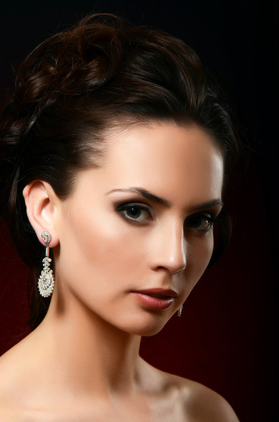 Woman in jewelry earrings - Foto, imagen