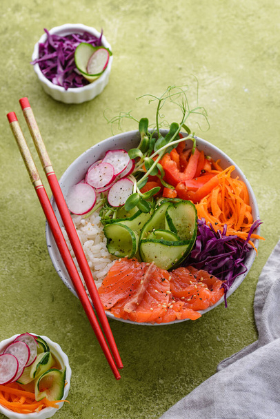 Hawaiian poke bowl with salmon, rice and vegetables - Zdjęcie, obraz