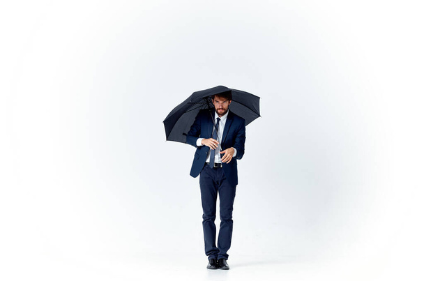 business man in suit with  umbrella,  protection  - Photo, image