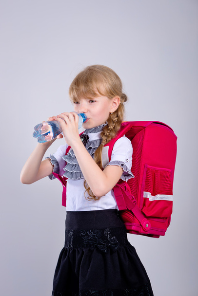 Girl drinking water from a plastic bottle - Zdjęcie, obraz