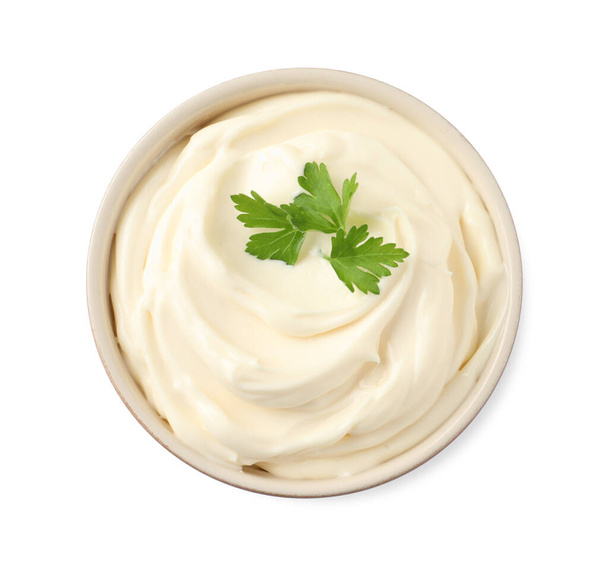 Bowl with delicious mayonnaise and parsley isolated on white, top view - 写真・画像