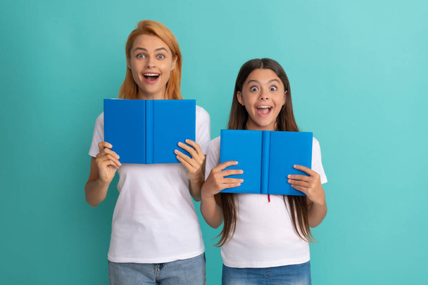 mother and daughter hold books. friendship. back to school. childhood education. - Photo, Image