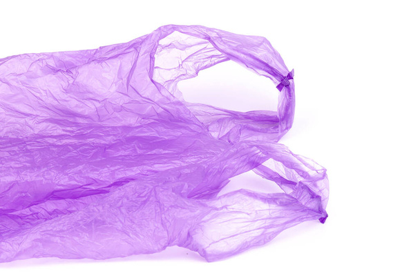 Transparent purple plastic bag with handles isolated over white background - Φωτογραφία, εικόνα