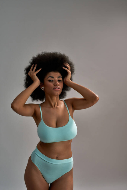 Seductive young african american woman in blue lingerie - Fotografie, Obrázek