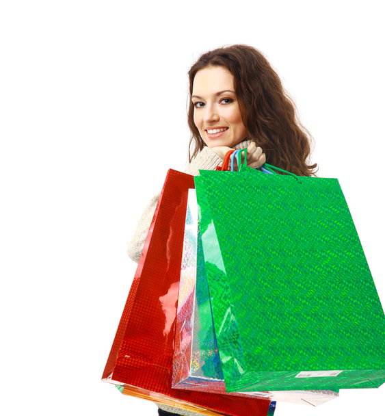 Portrait of an young woman holding several shoppingbag - Fotó, kép