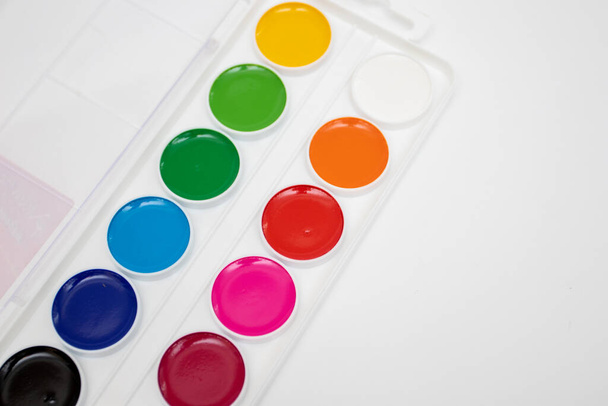 Top view of new set of watercolor palette paints in box isolated on white background. - Photo, Image
