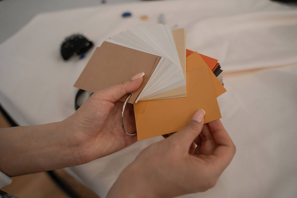Cropped view of designer holding color swatches  - Fotoğraf, Görsel