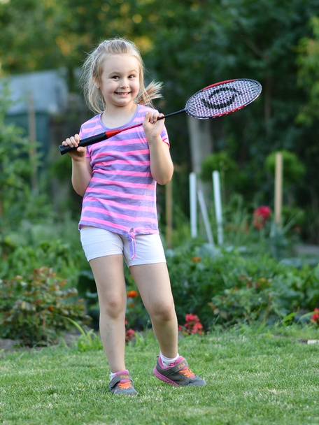 Cute little girl playing badminton - 写真・画像