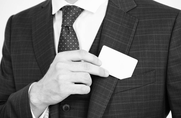 Showing his visiting card. Male hand take card out of suit pocket. Identification paper. Showpiece. Contact details. Formal occasion. Business information, copy space - Fotoğraf, Görsel