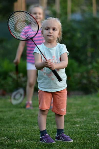 Cute little girl playing badminton - Fotoğraf, Görsel