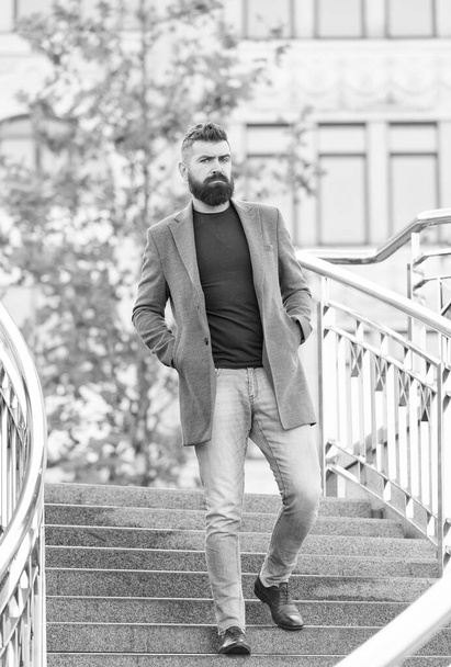 bearded hipster guy with stylish hairdo wear jacket and jeans for walking, beauty and fashion - Zdjęcie, obraz