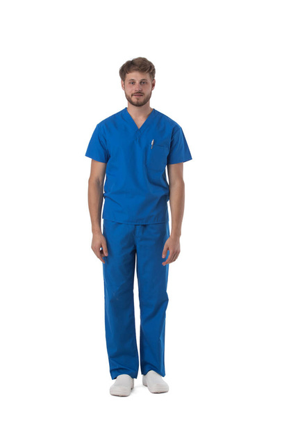Male nurse or doctor in blue uniform studio full length portrait isolated on white background - Valokuva, kuva