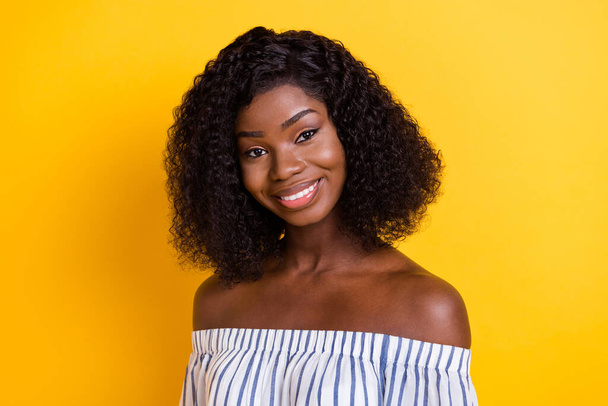 Photo of adorable cute dark skin woman wear striped outfit smiling isolated yellow color background - 写真・画像