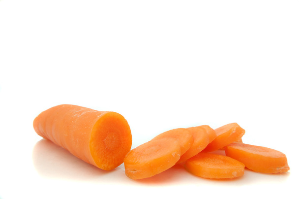 Partially sliced carrot. - Photo, Image